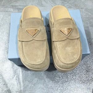 Prada Beige Suede Slip-On Mules with Gold Triangle Logo